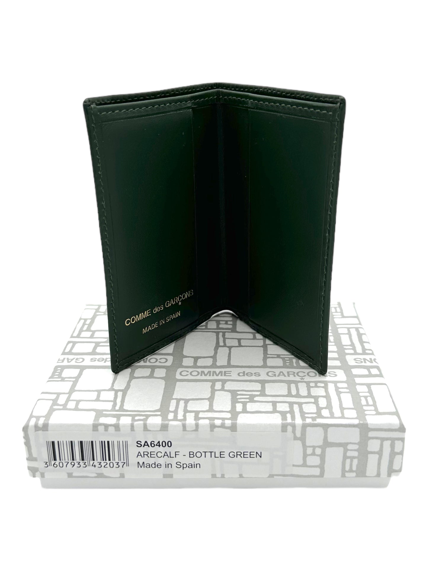 Comme Des Garcons Green Leather Bifold Cardholder - Genuine Design Luxury Consignment. New & Pre-Owned Clothing, Shoes, & Accessories. Calgary, Canada