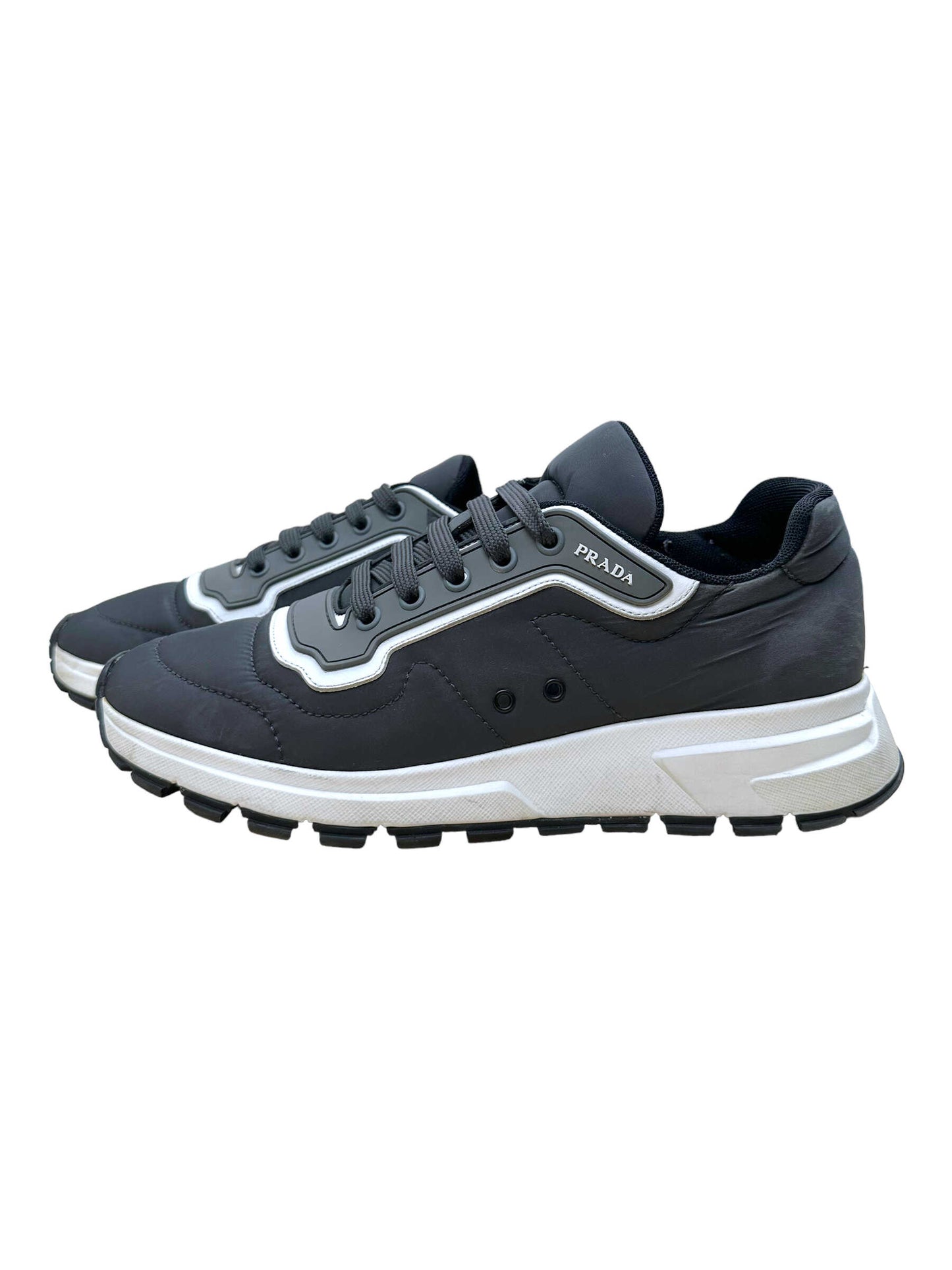 Prada Grey Re-Nylon Casual Sneakers - Genuine Design Luxury Consignment for Men. New & Pre-Owned Clothing, Shoes, & Accessories. Calgary, Canada
